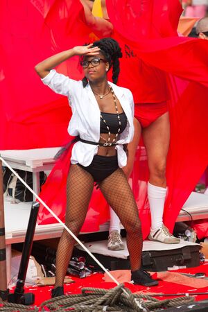 AMSTERDAM, THE NETHERLANDS - AUGUST 4, 2012: Participants dance in front of spectators at the famous Canal Parade of the Amsterdam Gay Pride 2012 on August 4, 2012 in Amsterdamのeditorial素材