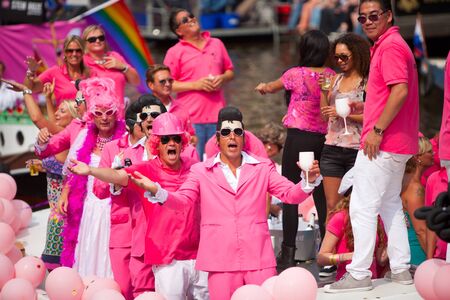 AMSTERDAM, THE NETHERLANDS - AUGUST 4, 2012: Participants dance in front of spectators at the famous Canal Parade of the Amsterdam Gay Pride 2012 on August 4, 2012 in Amsterdamのeditorial素材