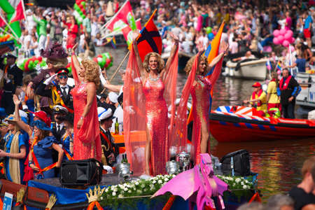 AMSTERDAM, THE NETHERLANDS - AUGUST 4, 2012: Participants dance in front of spectators at the famous Canal Parade of the Amsterdam Gay Pride 2012 on August 4, 2012 in Amsterdamのeditorial素材