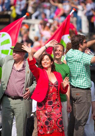 AMSTERDAM, THE NETHERLANDS - AUGUST 4, 2012: Politician Jolanda Sap and other participants dance in front of spectators at the famous Canal Parade of the Amsterdam Gay Pride 2012 on August 4, 2012 in Amsterdamのeditorial素材
