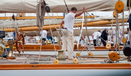 CANNES, FRANCE - SEPTEMBER 28, 2012: Unidentified crew members in the harbor after the 34th edition...