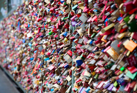 COLOGNE, GERMANY - MAY 29, 2014, Thousands of love locks which sweethearts lock to the Hohenzollern Bridge to symbolize their love on May 29 in Koln, Germanyのeditorial素材