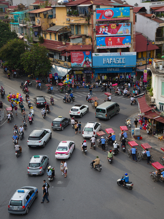 HANOI, VIETNAM - SEPTEMBER 2, 2015: unidentified residents of Hanoi are driving from the central roundabout at Hoam Kiem Lake to the Old Quarter in Hanoi, Vietnamのeditorial素材