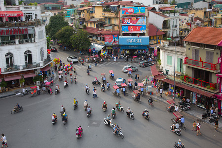 HANOI, VIETNAM - SEPTEMBER 2, 2015: unidentified residents of Hanoi are driving from the central roundabout at Hoam Kiem Lake to the Old Quarter in Hanoi, Vietnamのeditorial素材