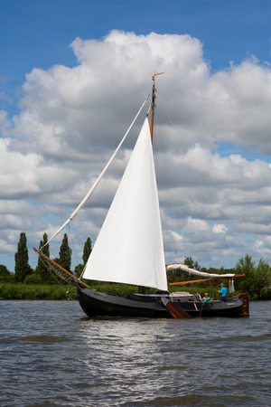 Heeg, Friesland, The Netherlands - August 5, 2018; Dutch traditional ship is sailing near Heeg,...