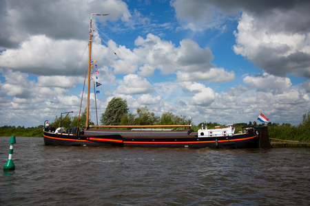 Sneek, Friesland, The Netherlands - August 11, 2018; Dutch traditional ship near Sneek, Friesland, The Netherlandsのeditorial素材