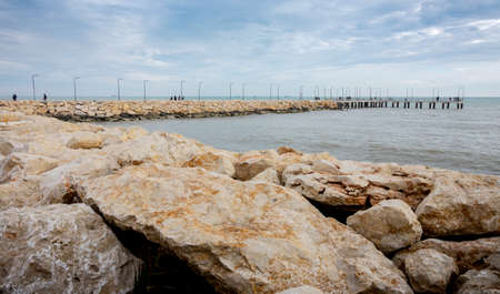 Rocks driving to a dock were the people can go to enjoy the views