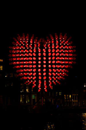 Amsterdam,the Netherlands-Dec 14, 2014:Big red hart of lightbulbs during Amsterdam light festival.のeditorial素材
