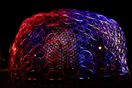 Amsterdam,the Netherlands-Dec 14, 2014:Big construction of colourful red and blue bicycle wheels...