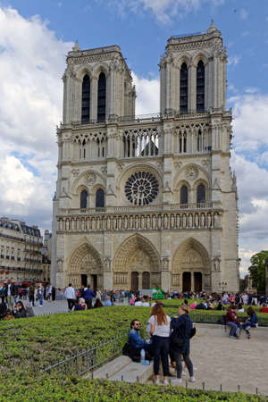 Paris, France,April,2,2017:Gothic Catholic Cathedral Notre-Dame de Paris, with tourist and people. Is one of the largest and well known churches in the world. On April 15 2019 hit by large fireのeditorial素材
