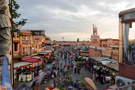 Marrakesh, Morocco,.Okt,7,2018:Djemaa el Fna market square, people tourists stroll across the square to eat or shop. Jemaa el-Fnaa is a famous square and market place in Marrakeshs medina quarter.のeditorial素材