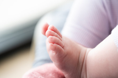 Close-up of a tiny baby's feet. Shallow depth of field.の写真素材
