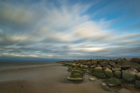 breakwater and sunrise coloured cloudsのeditorial素材
