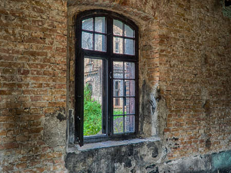 An old building ruined by the time. The window in the ruined building. HDR photograph of the old...