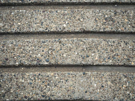 Background of gray stones texture close up. A mosaic of tiny gravel stones. Tiny gravel stones pattern.の写真素材