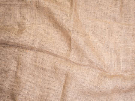 Old rural burlap vintage background, photo top view. Hessian, sacking texture, background for your design. Copy space for your message.の写真素材
