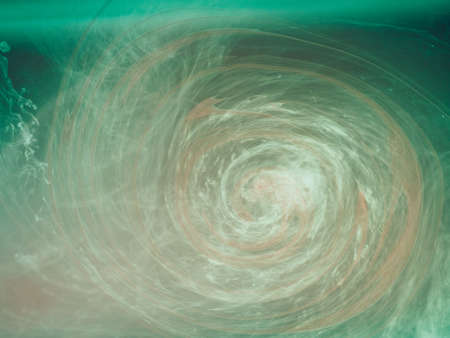 Abstract colored background. Colored smoke, ink in water, the patterns of the universe. Abstract movement, frozen multicolor flow of paint. Horizontal photo with soft focus, blurred backdrop.の写真素材