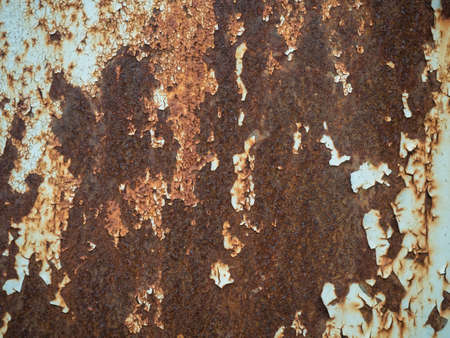 Texture of old rusty metal with streaks of rust and cracked, flaking paint. Surface of rusty metal...