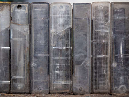 An old audiotapes in dirty plastic boxes, close up view. Background of vintage audio cassettes...