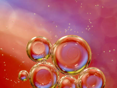 Water bubbles, an abstract background. Close up shot. Blurred background. Colorful glittering spheres. Pattern of glittering universe. Motion of water bubbles in liquid. Macro shotの写真素材