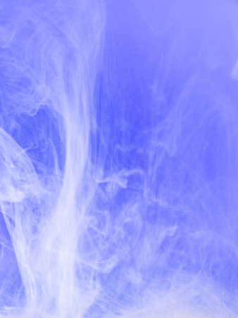 Droplet of lilac paint dissolving into water, close up view. Blurred background. Acrylic clouds moving in water, abstract background. Lilac ink mixing with liquid, abstract patternの写真素材