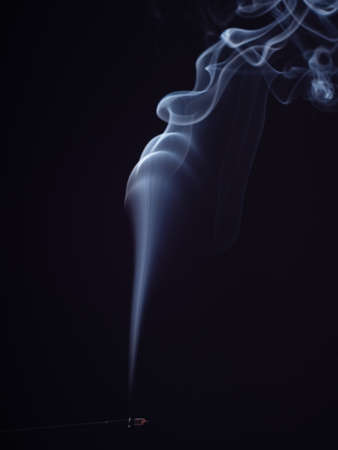 White smoke swirling on black background, close up view, isolated. Structure of white smoke, brush...