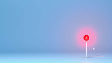 Glowing Christmas ball on blue background. Creative concept electric lamp for Christmas and New Year...