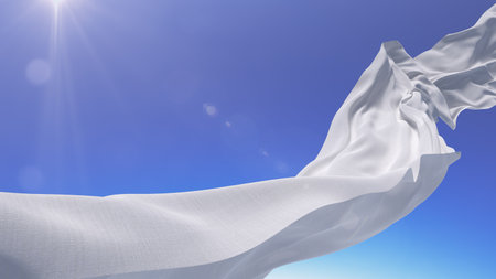 Piece of white fabric flying in the sky background. Natural effect of lens flare from sunの写真素材