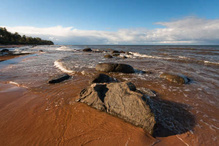 sunny seascapes with stonesの写真素材