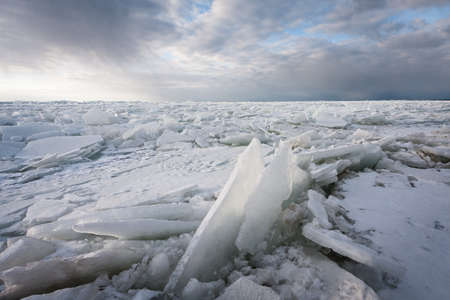 ice piles by sea