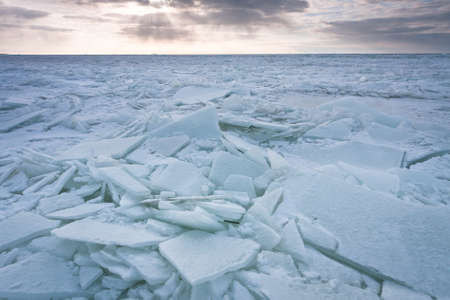 ice piles by sea