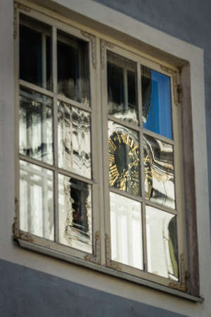 old tallin reflections in window