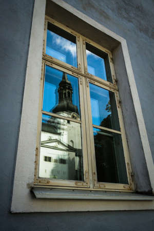 old tallin reflections in window