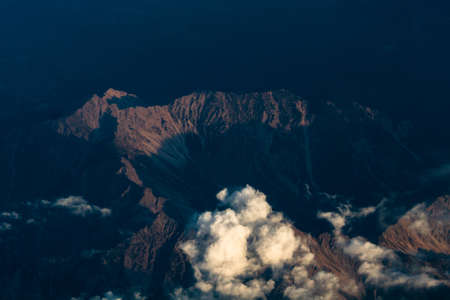 white and colored clouds from airplaneの写真素材