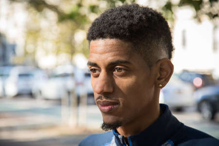 A portrait of a young man on an Autumn day in Central Park. Shot during the Autumn of 2016 in New York City.の写真素材