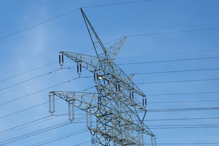 Electricity poles against the sky.