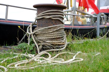 Bollard with ropes at the harbor