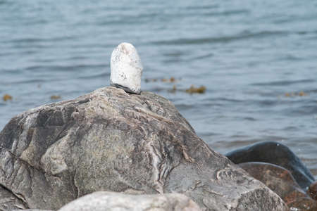 Stacked stones by the seaの写真素材
