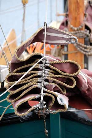 Folded foresail on a windjammerの写真素材