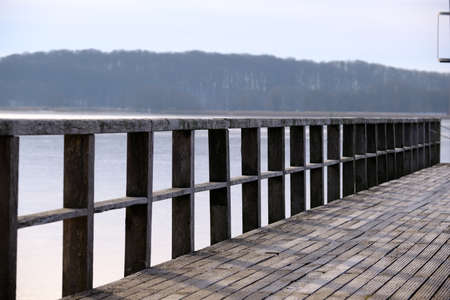 Jetty in the bathing area of a body of waterの写真素材