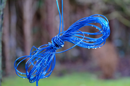 Coiled clothesline with raindrops