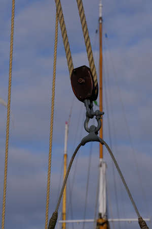A pulley block as an aid for heavy loads on an old sailing yachtの写真素材