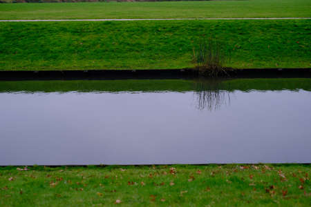 A watercourse crosses a lawnの写真素材