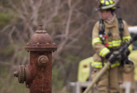 Fire Hydrant with Firefighterのeditorial素材