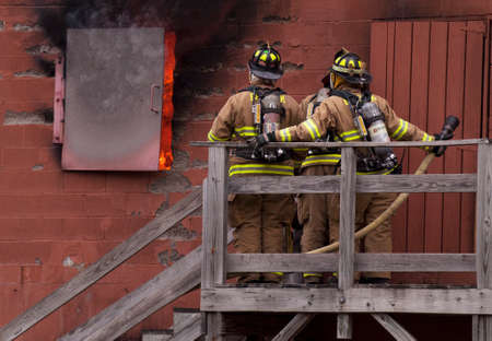 Firefighters Waiting to go in Burn House for Trainingのeditorial素材
