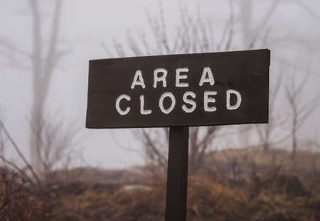 Outdoor Wooden Sign that says "Area Closed"の写真素材