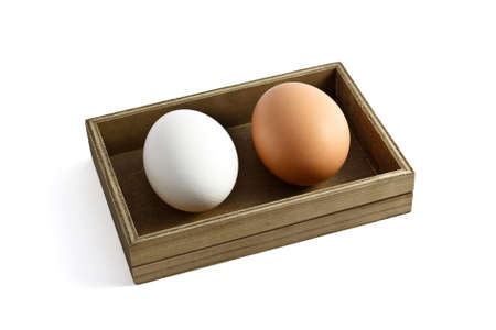 Wooden box with two eggsの写真素材