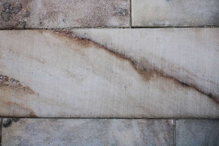 large blocks of white and gray marble with multicolored striations