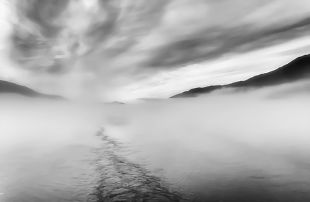 Abstract Black and White Line Created by Wake in Fog at Seaの写真素材