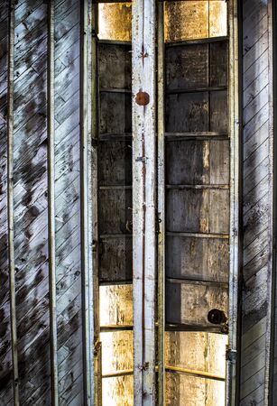 Lines textures and shapes in old wood.  Ceiling of abandoned industrial cannery building taken from...
